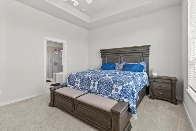 a view of a lake with houses in the background