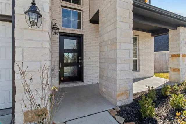a view of an entryway with wooden floor