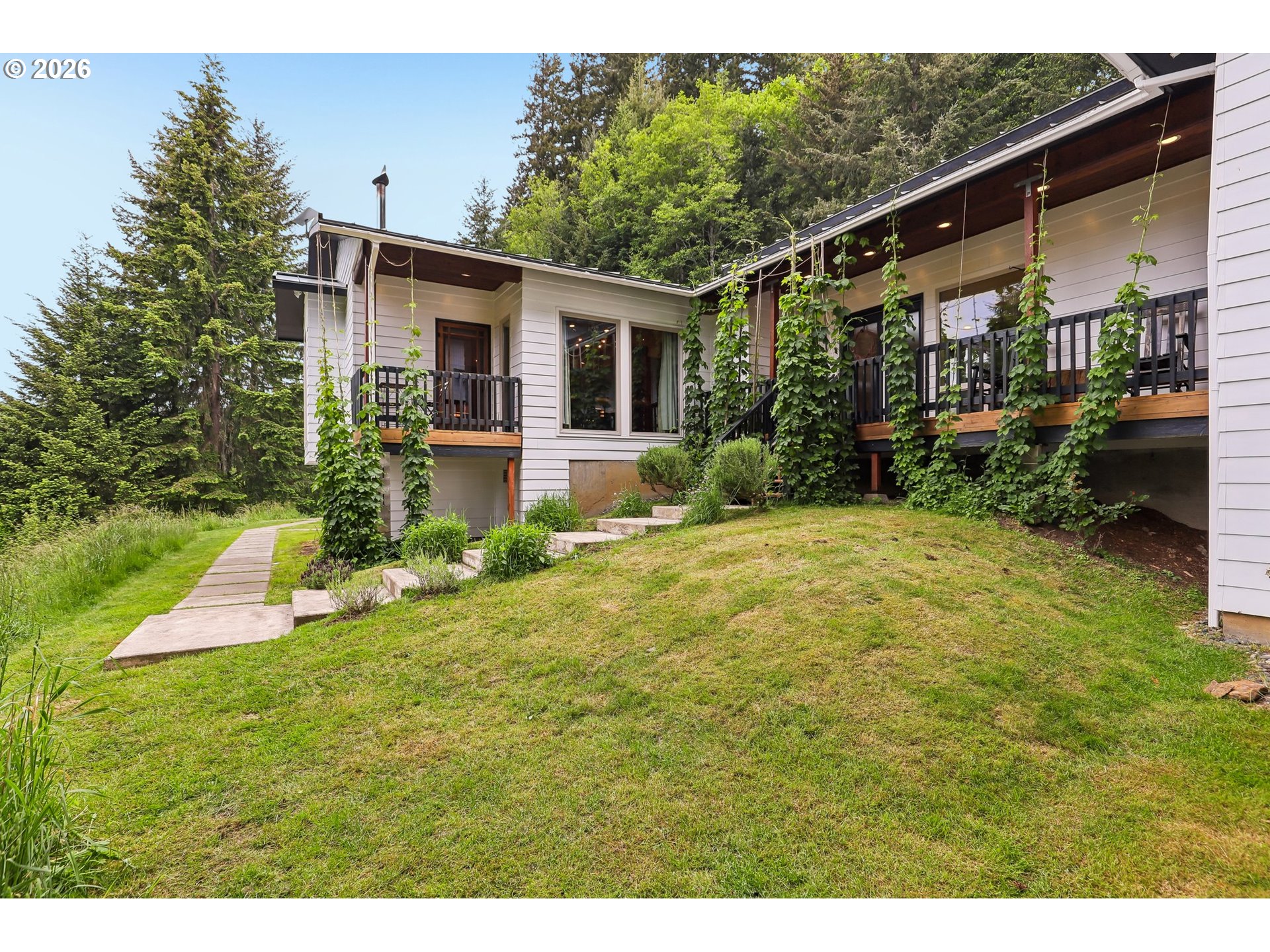 873 Mountain View Road Kalama, WA 98625 - Photo 4 of 45 a view of a house with a yard porch and sitting area