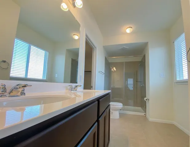 a bathroom with a sink a toilet and a bathtub