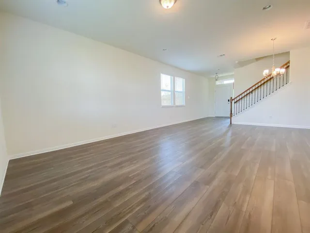 a view of an empty room and closet