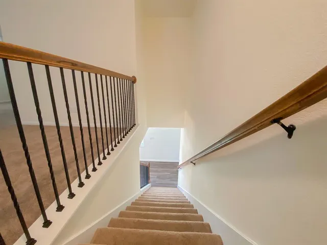 an empty room with closet and bathroom