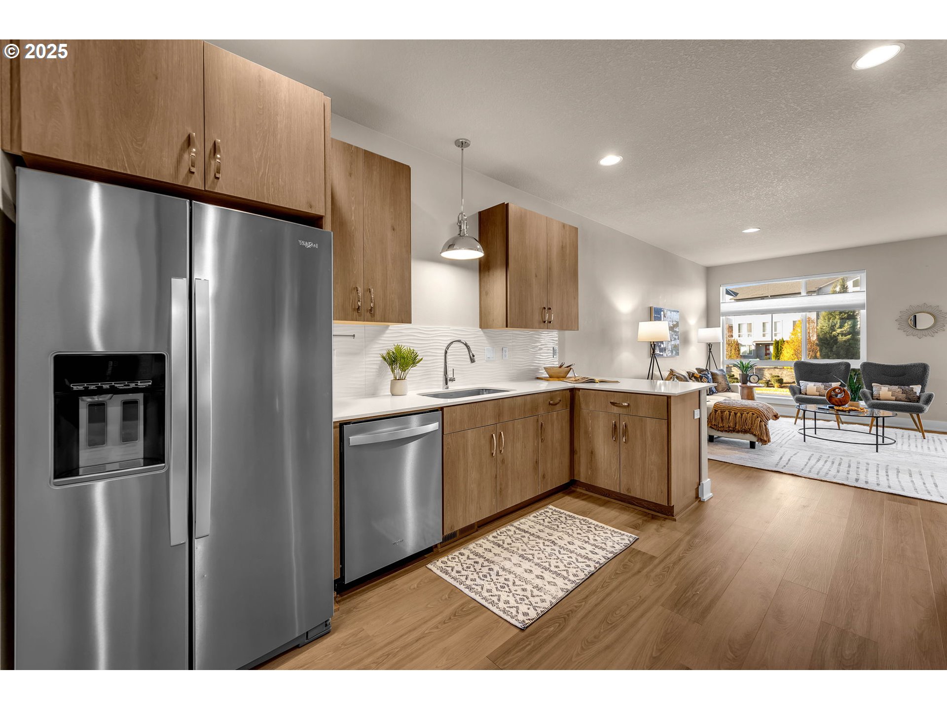 17238 Southwest Goldcrest Lane Beaverton, OR 97007 - Photo 13 of 48 a kitchen with stainless steel appliances granite countertop a refrigerator sink and cabinets