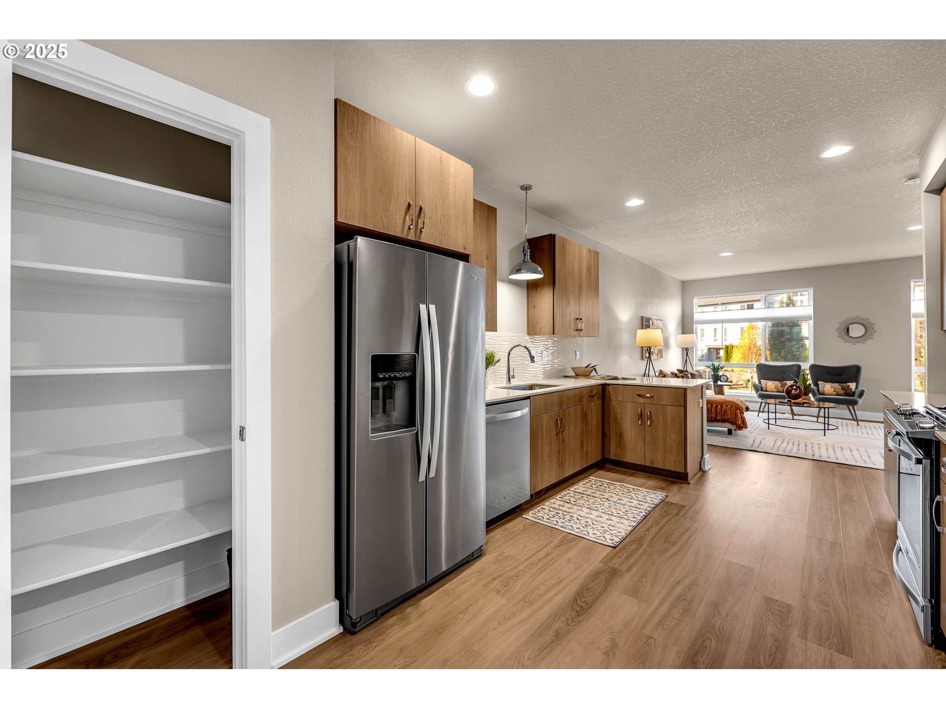 17238 Southwest Goldcrest Lane Beaverton, OR 97007 - Photo 14 of 48 a kitchen with a refrigerator and a sink
