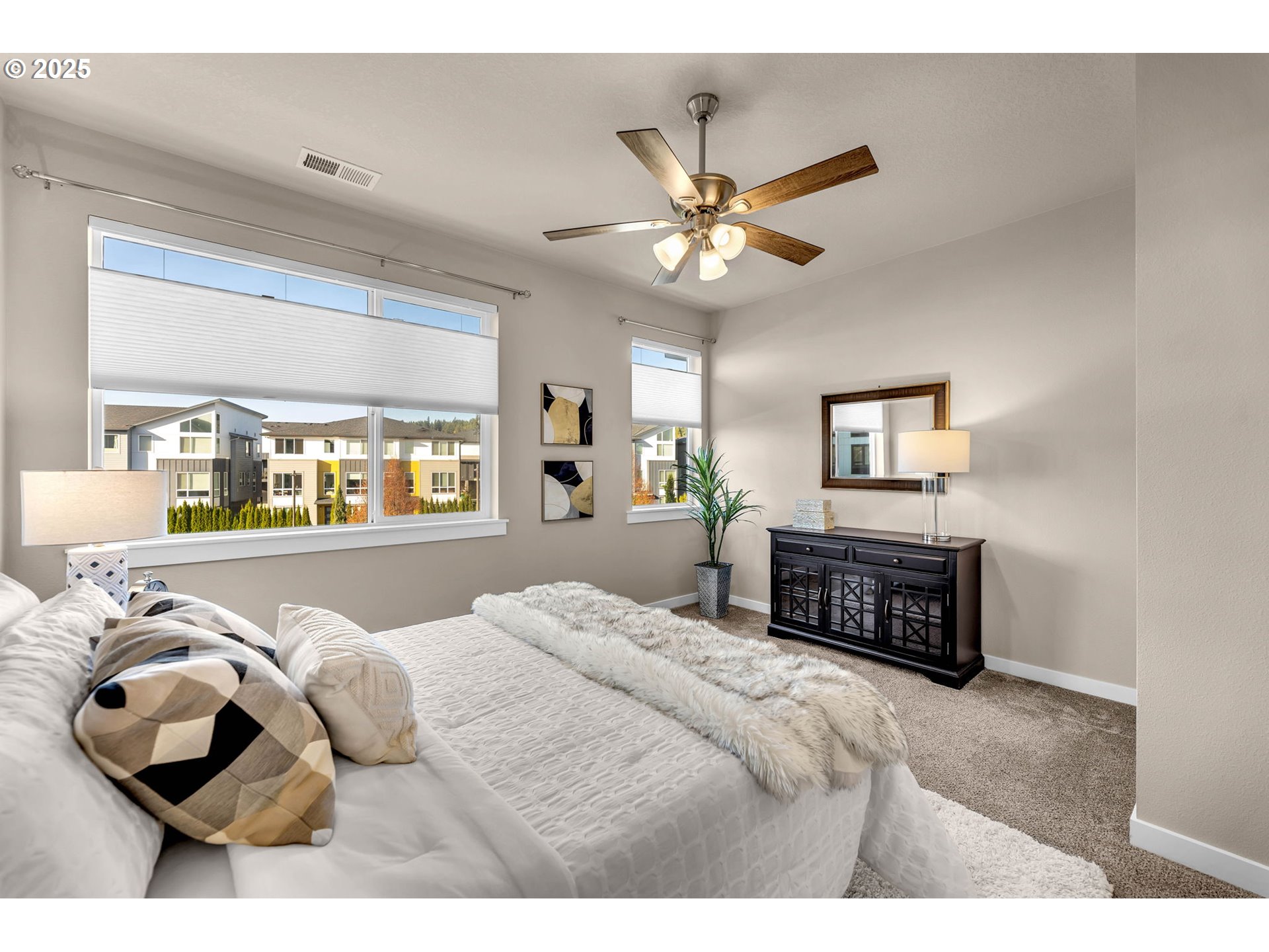 17238 Southwest Goldcrest Lane Beaverton, OR 97007 - Photo 30 of 48 a bedroom with a large bed and a chandelier
