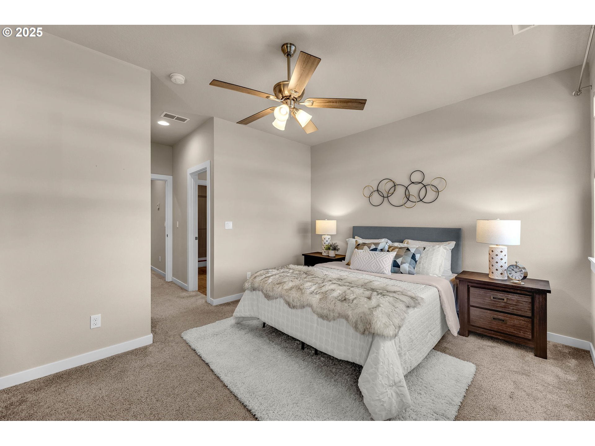 17238 Southwest Goldcrest Lane Beaverton, OR 97007 - Photo 31 of 48 a bedroom with a bed and a ceiling fan