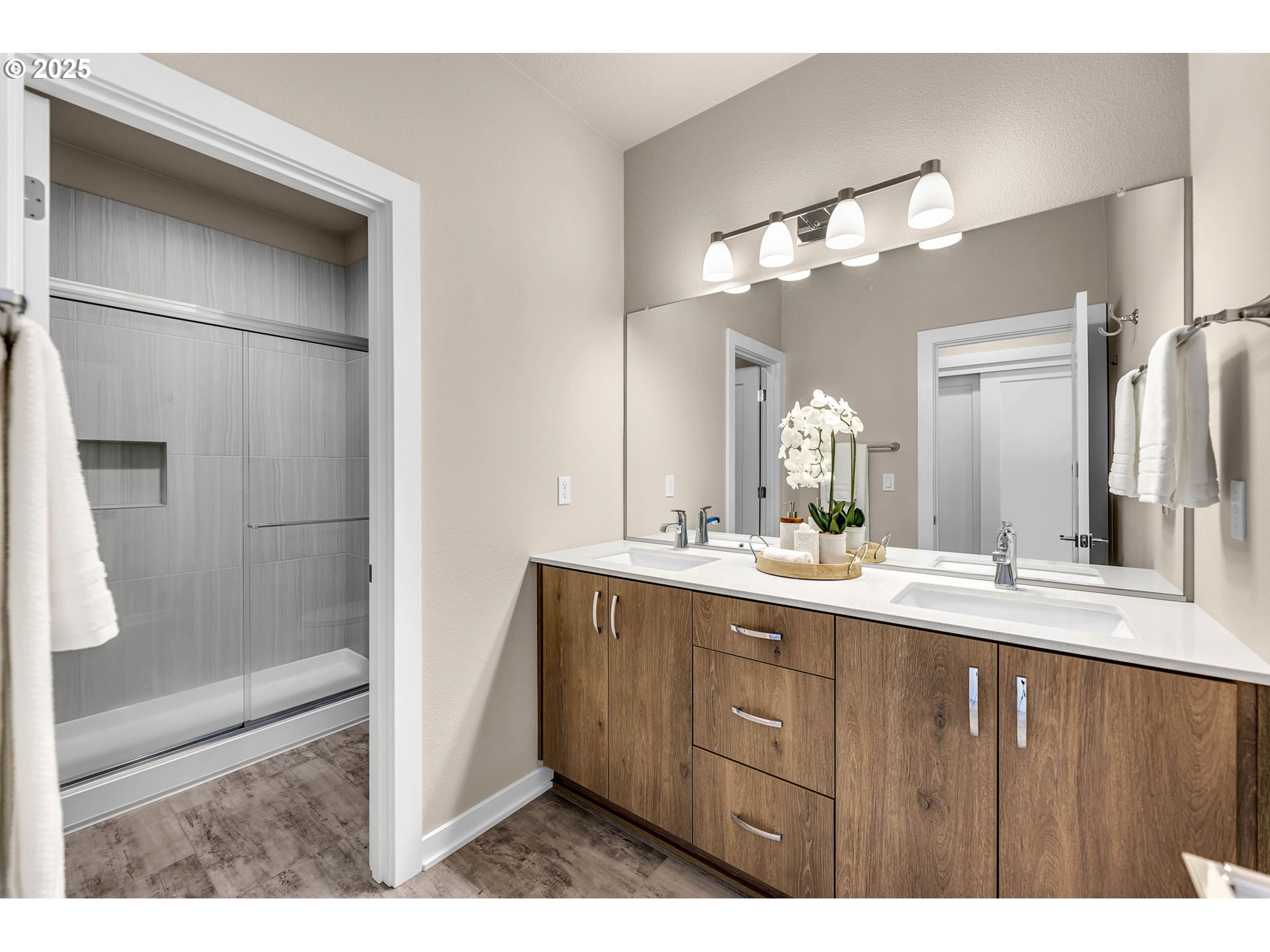 17238 Southwest Goldcrest Lane Beaverton, OR 97007 - Photo 33 of 48 a bathroom with a double vanity sink and a mirror