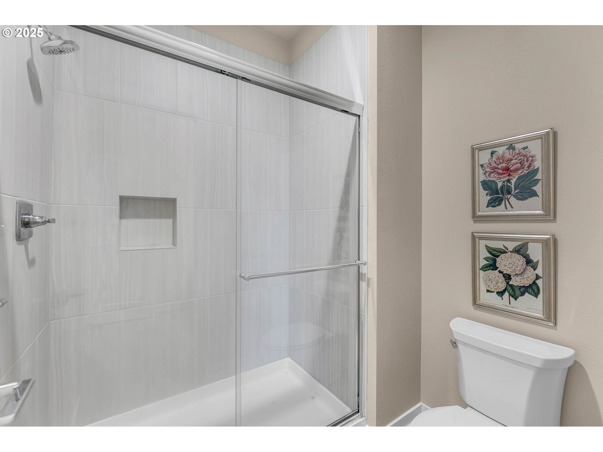 17238 Southwest Goldcrest Lane Beaverton, OR 97007 - Photo 34 of 48 a bathroom with a shower and a painting on the wall