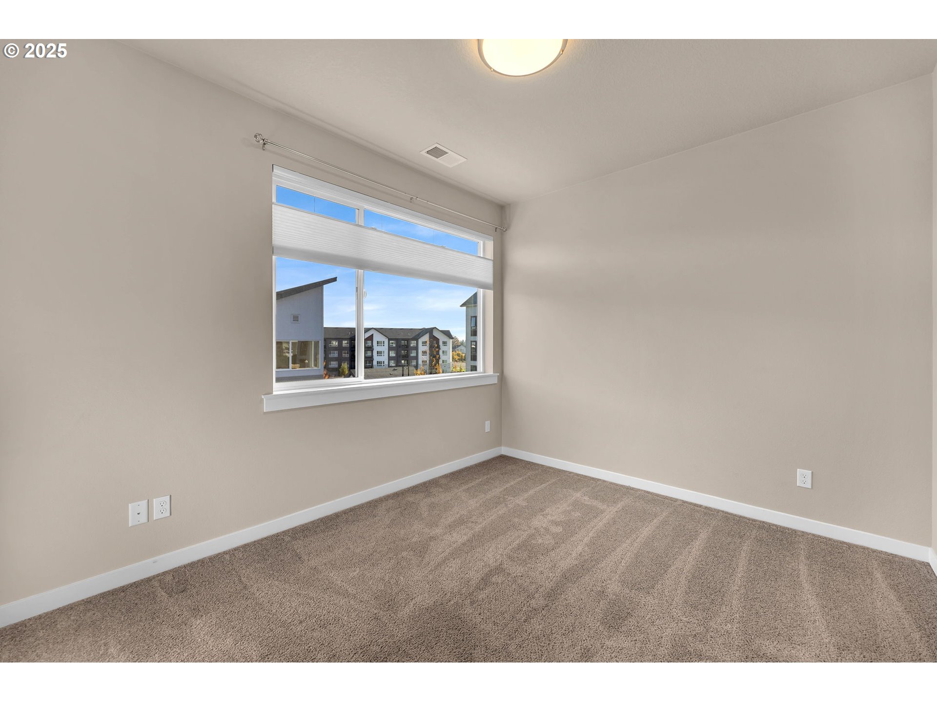 17238 Southwest Goldcrest Lane Beaverton, OR 97007 - Photo 36 of 48 a view of an empty room with a window