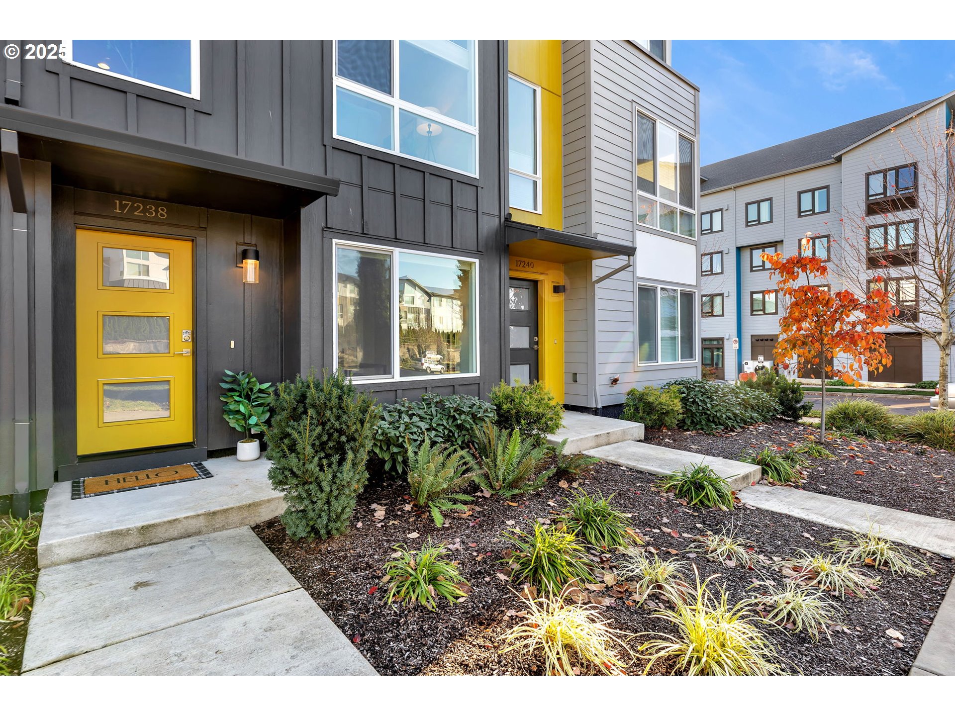 17238 Southwest Goldcrest Lane Beaverton, OR 97007 - Photo 5 of 48 a view of a building with potted plants