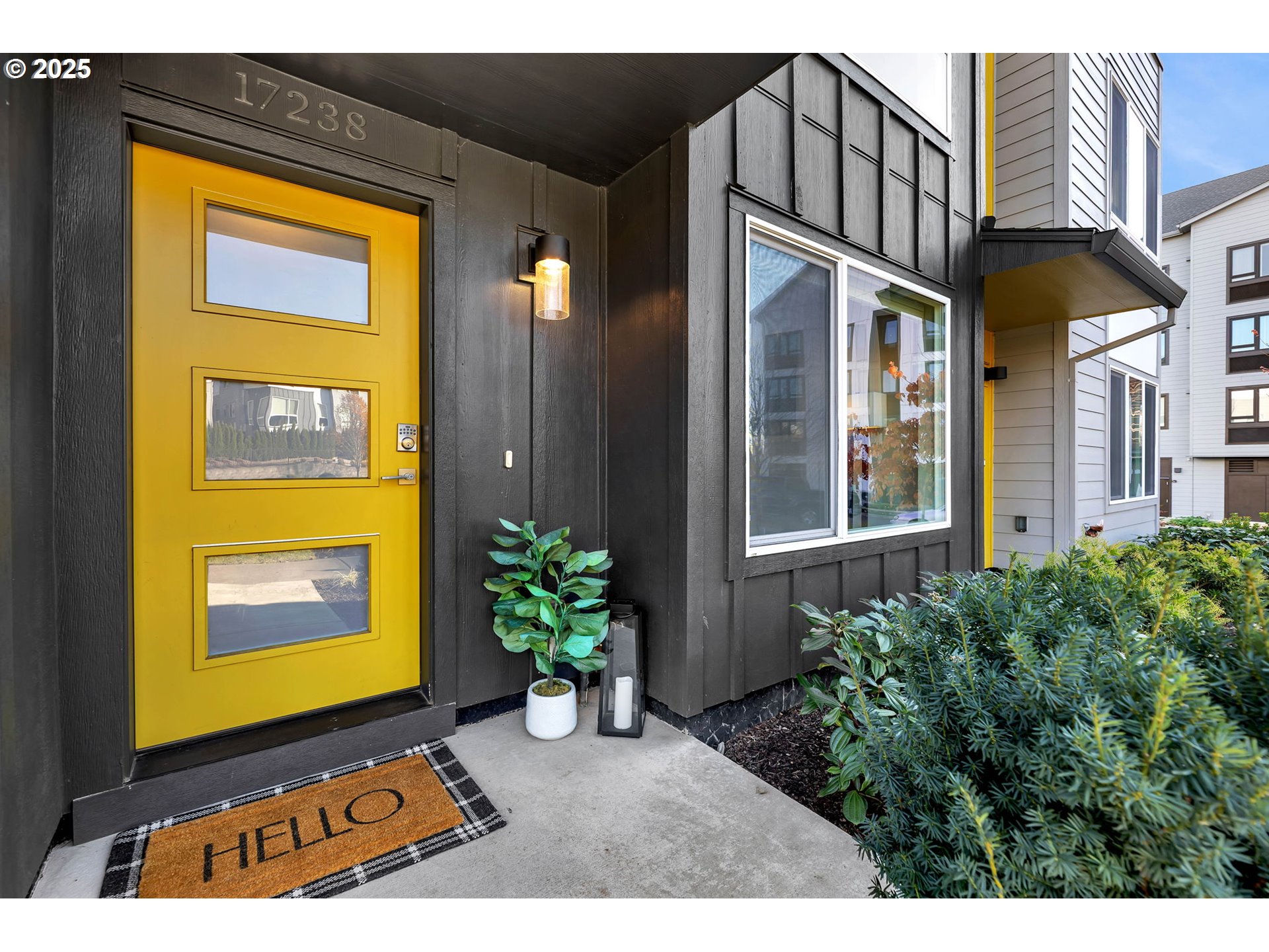 17238 Southwest Goldcrest Lane Beaverton, OR 97007 - Photo 6 of 48 a view of a brick house with potted plants