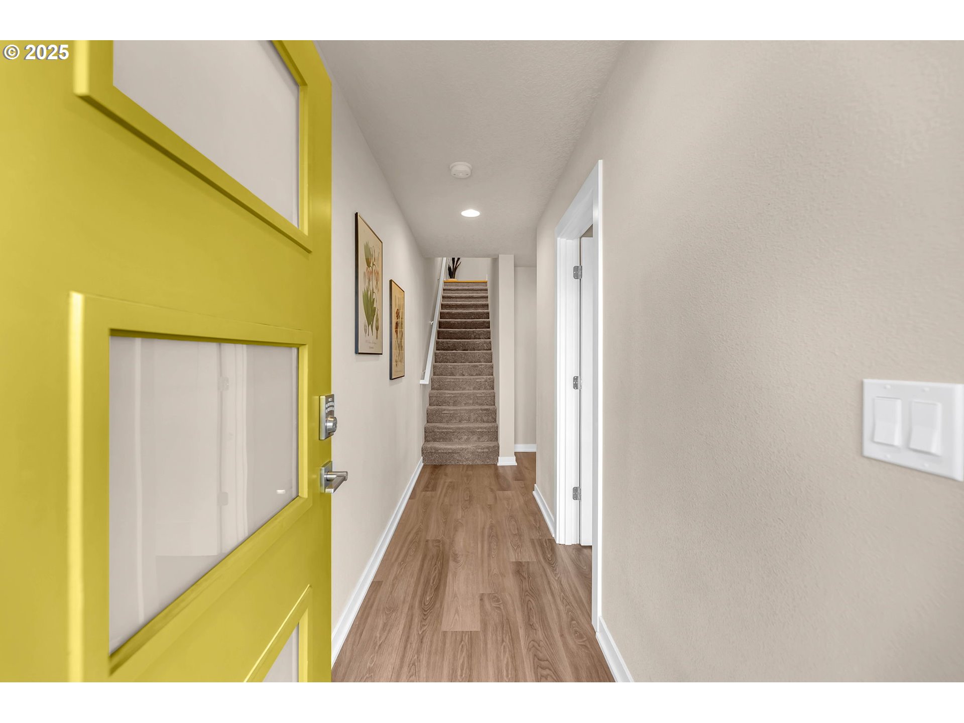 17238 Southwest Goldcrest Lane Beaverton, OR 97007 - Photo 7 of 48 a view of a hallway with wooden floor