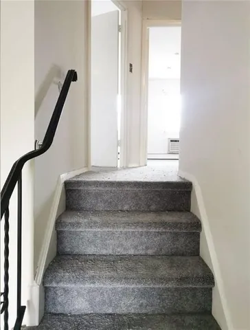 a bathroom with a sink mirror and toilet