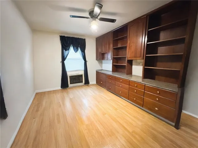 a room with a bed and furniture