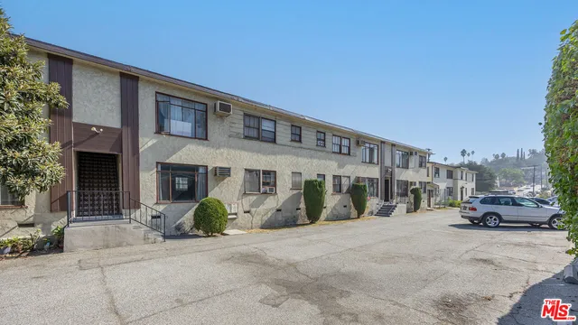 a view of car parked in front of house