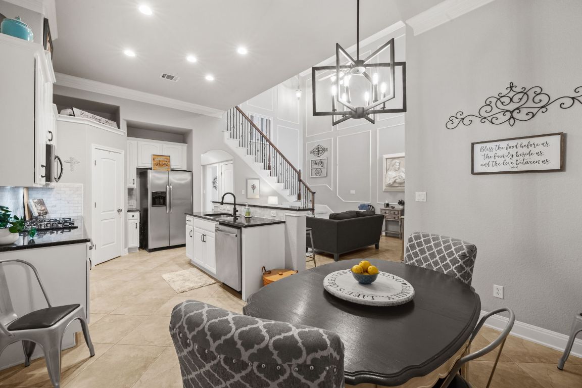 218 Sunrise Ridge Loop Lakeway, TX 78738 - Photo 13 of 40 a living room with furniture and kitchen view