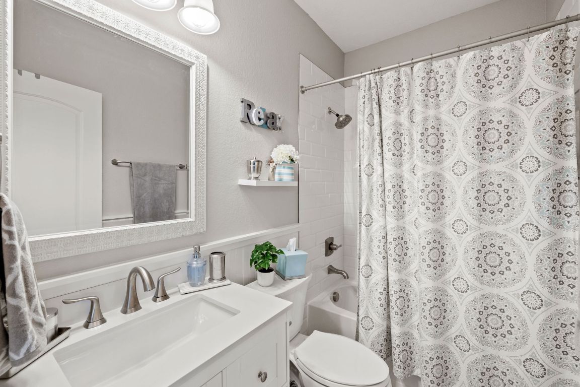 218 Sunrise Ridge Loop Lakeway, TX 78738 - Photo 28 of 40 a bathroom with a sink toilet and shower