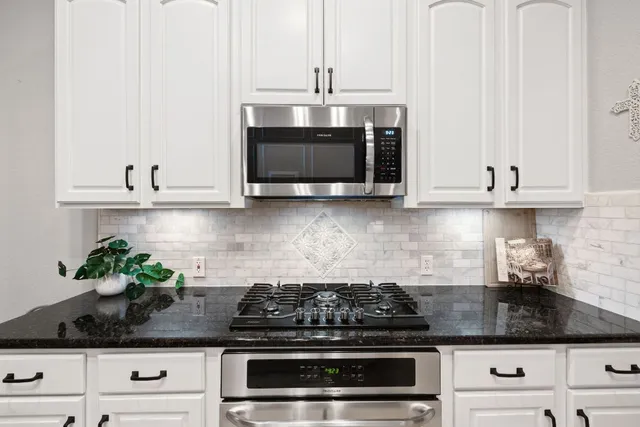 a bathroom with a sink mirror and toilet