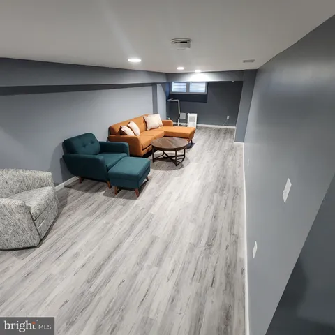 a room with furniture and wooden floor