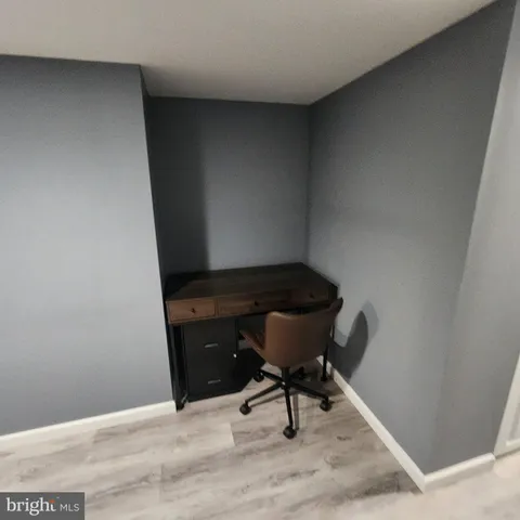 a view of chair and table in wooden floor