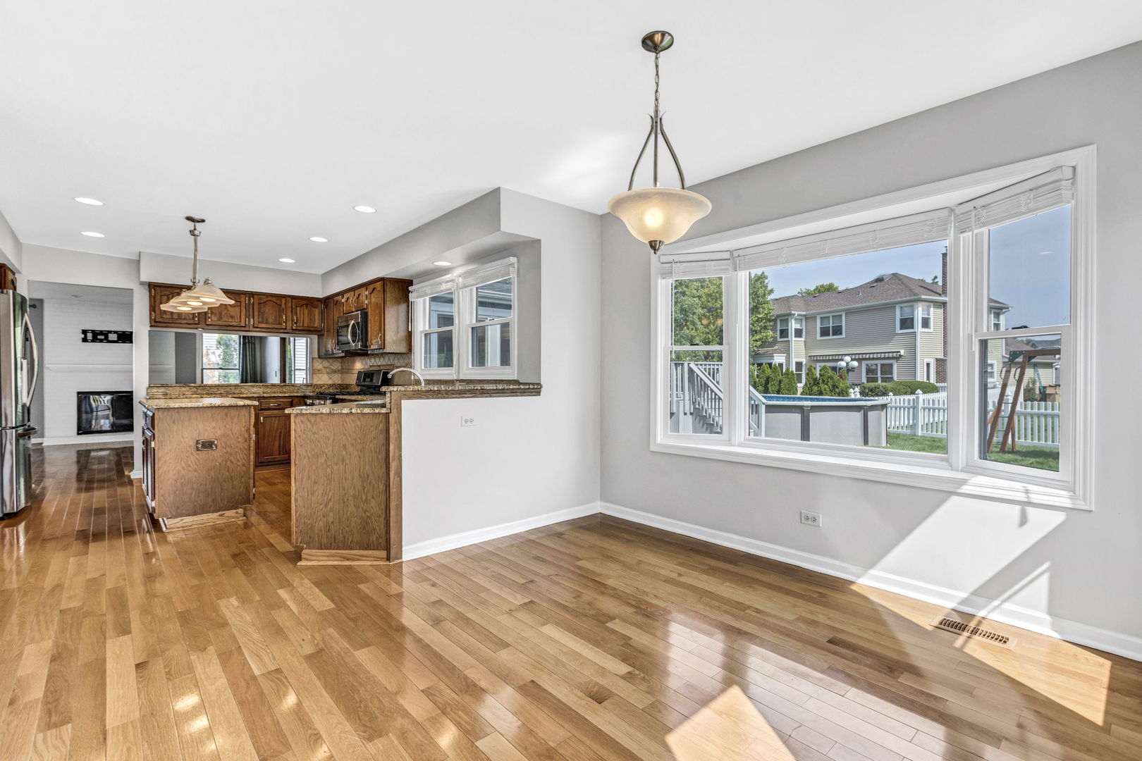 1726 Biesterfield Road Elk Grove Village, IL 60007 - Photo 11 of 25 a open kitchen with stainless steel appliances granite countertop a stove and refrigerator