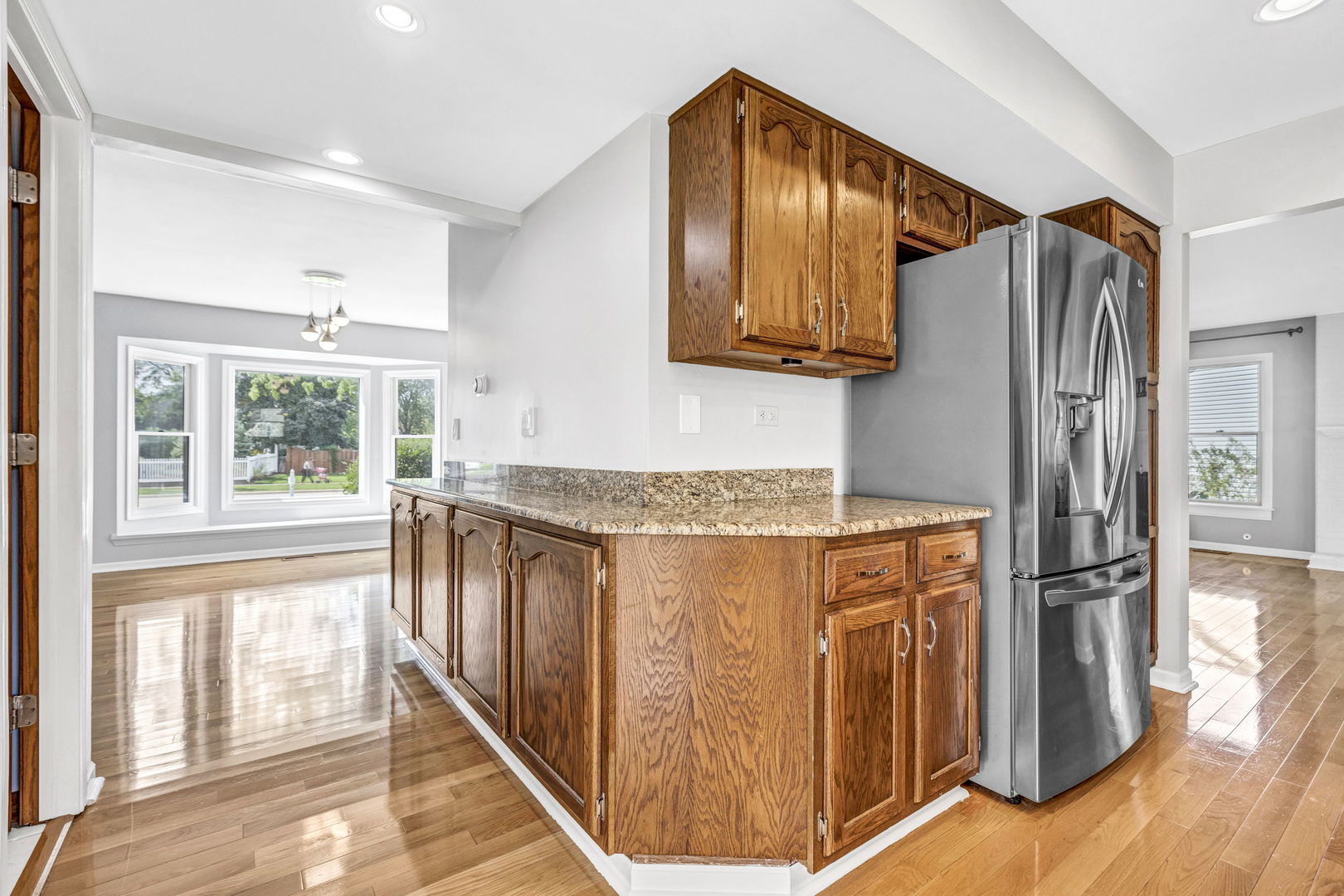 1726 Biesterfield Road Elk Grove Village, IL 60007 - Photo 12 of 25 a kitchen with stainless steel appliances granite countertop a refrigerator and a stove