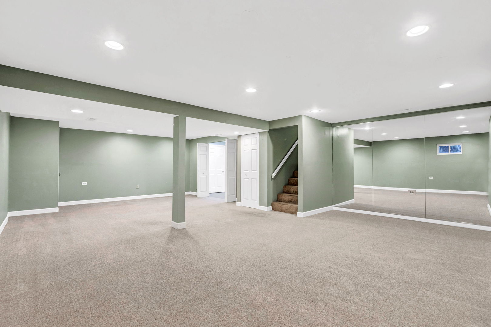 1726 Biesterfield Road Elk Grove Village, IL 60007 - Photo 20 of 25 an empty room with window and stairs