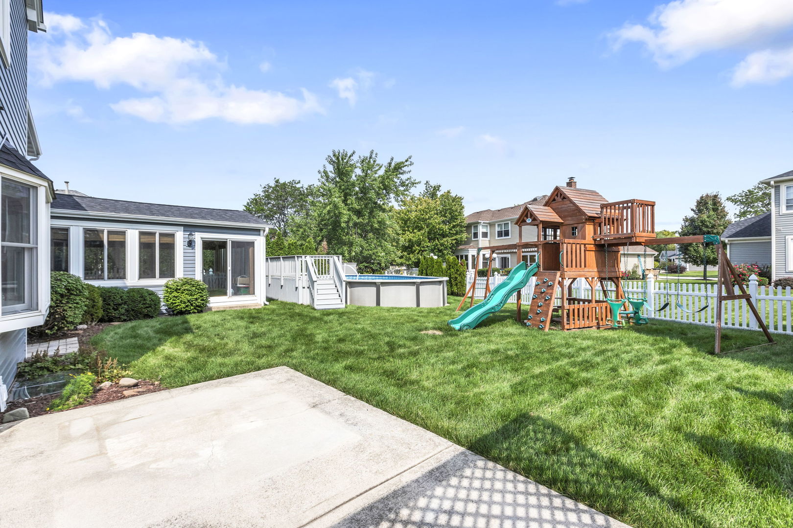 1726 Biesterfield Road Elk Grove Village, IL 60007 - Photo 25 of 25 a view of a house with a yard and a garden