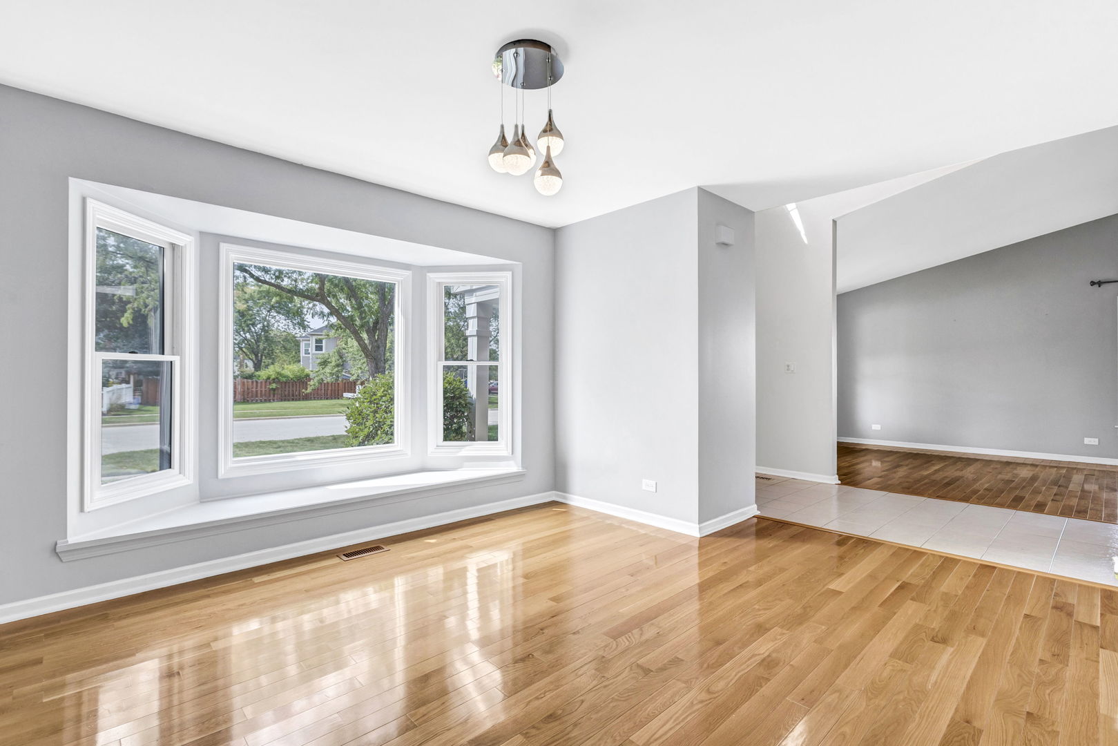 1726 Biesterfield Road Elk Grove Village, IL 60007 - Photo 7 of 25 a view of an empty room with a window