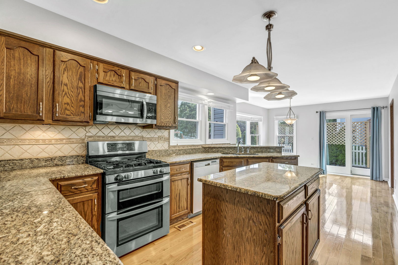 1726 Biesterfield Road Elk Grove Village, IL 60007 - Photo 8 of 25 a kitchen with sink stove and microwave