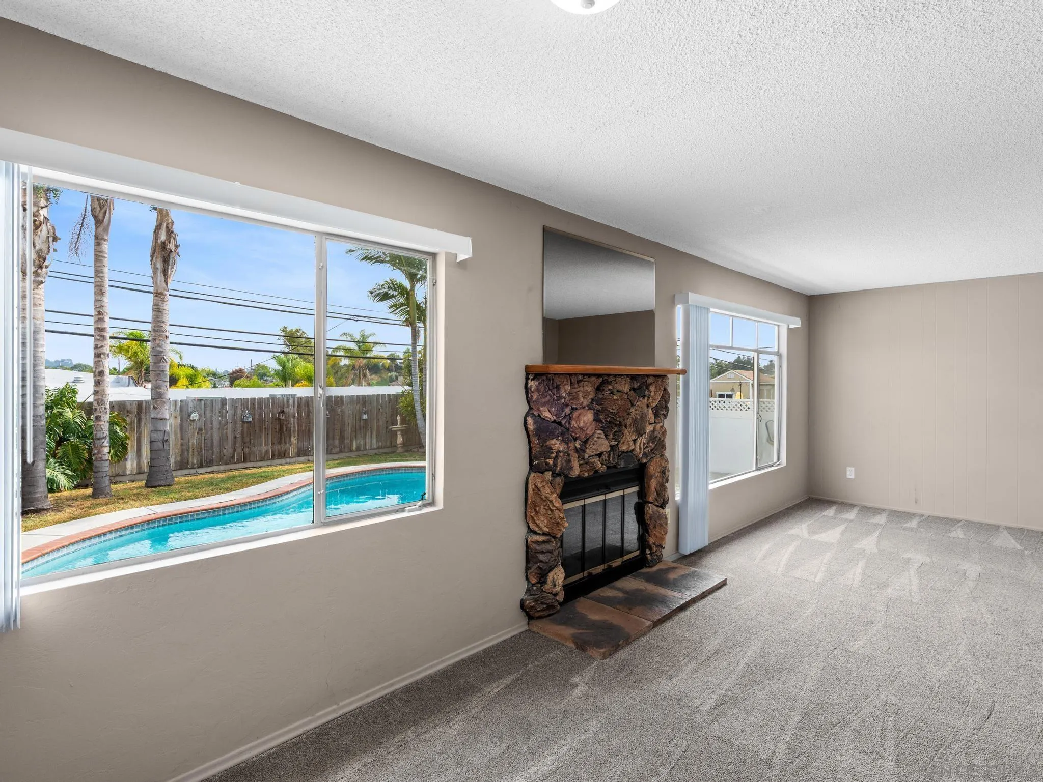 2529 Littleton Road El Cajon, CA 92020 - Photo 4 of 26 an empty room with windows and painted walls