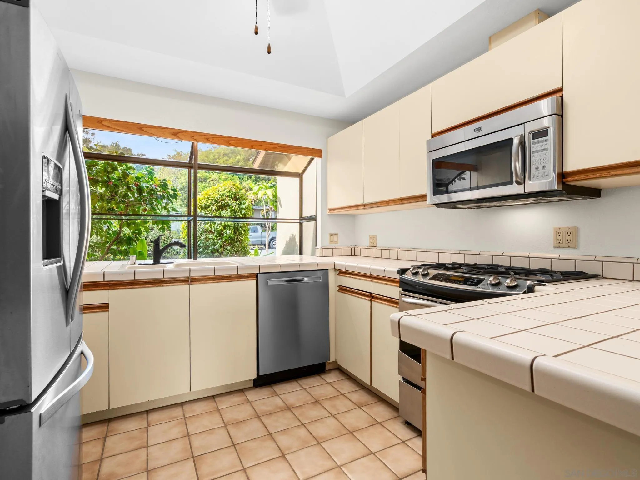 2529 Littleton Road El Cajon, CA 92020 - Photo 9 of 26 a kitchen with a stove and a microwave