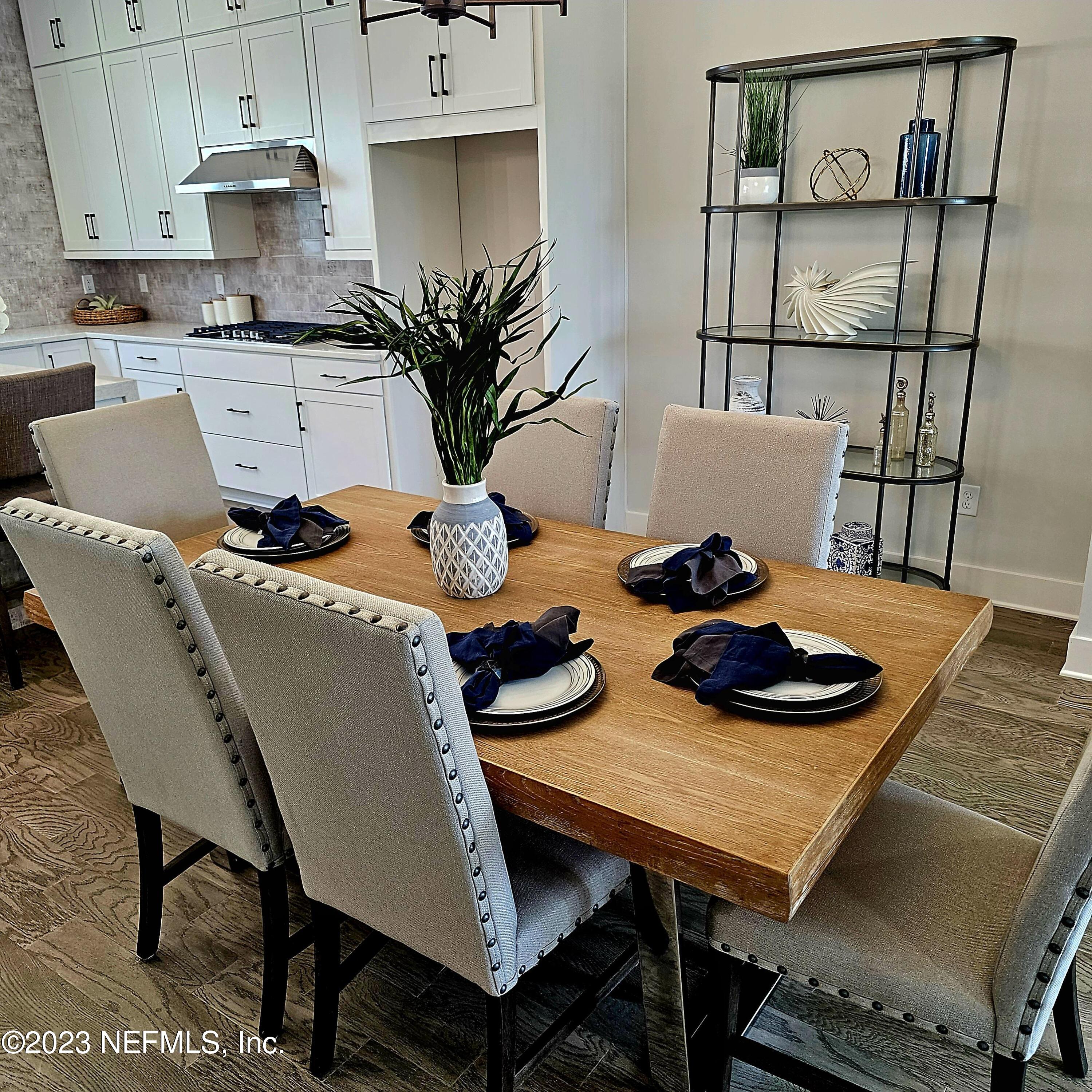 1625 Bridgeton Drive Jacksonville, FL 32207 - Photo 11 of 26 a table and chairs in a kitchen
