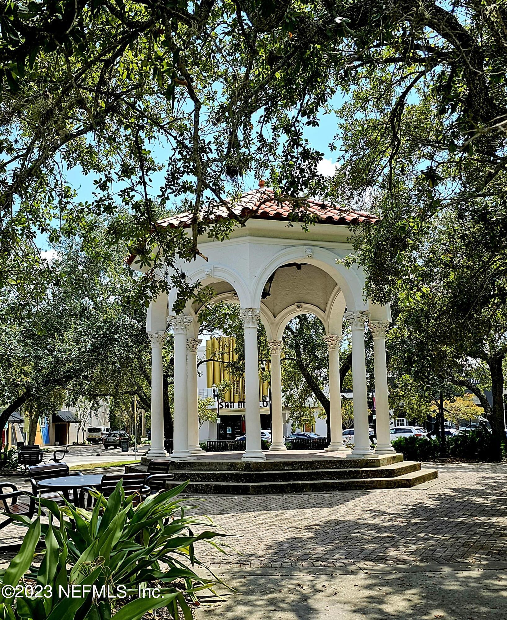 1625 Bridgeton Drive Jacksonville, FL 32207 - Photo 25 of 26 a couple of potted plants sitting in front of a building