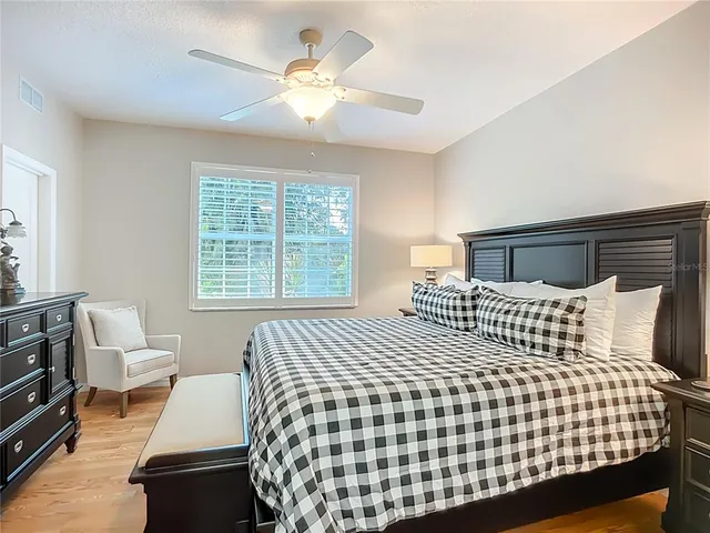 a bedroom with a bed and a couch