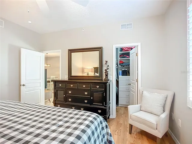 a bedroom with a bed and a dresser