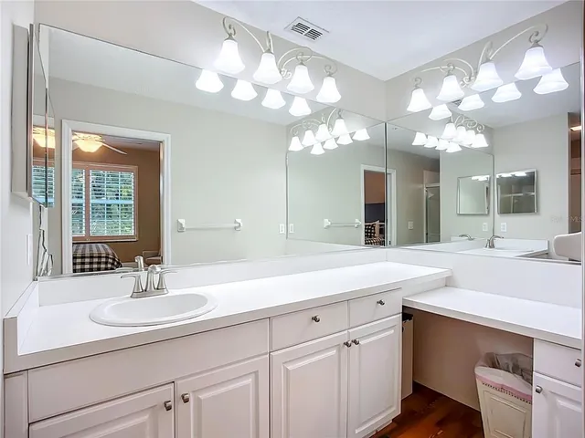 a bathroom with a sink double vanity and a mirror