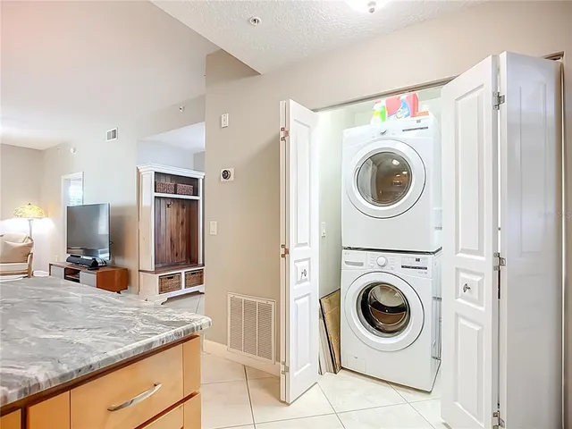 a view of a kitchen with washer and dryer