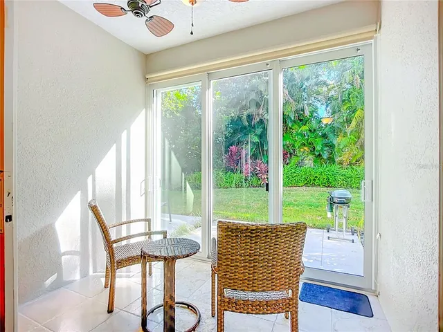 a view of a dining room with furniture wooden floor and a large window