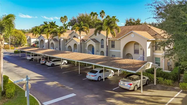 a view of a patio with table and chairs and potted plants