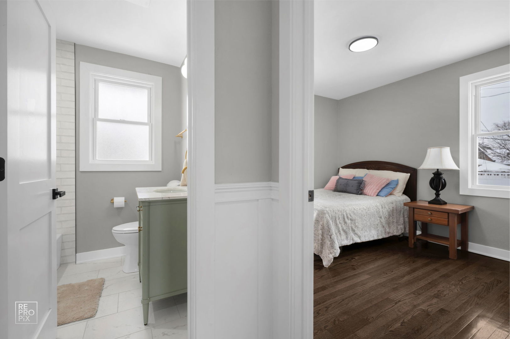 9133 Oak Park Avenue Morton Grove, IL 60053 - Photo 5 of 10 a bedroom with a bed and a window