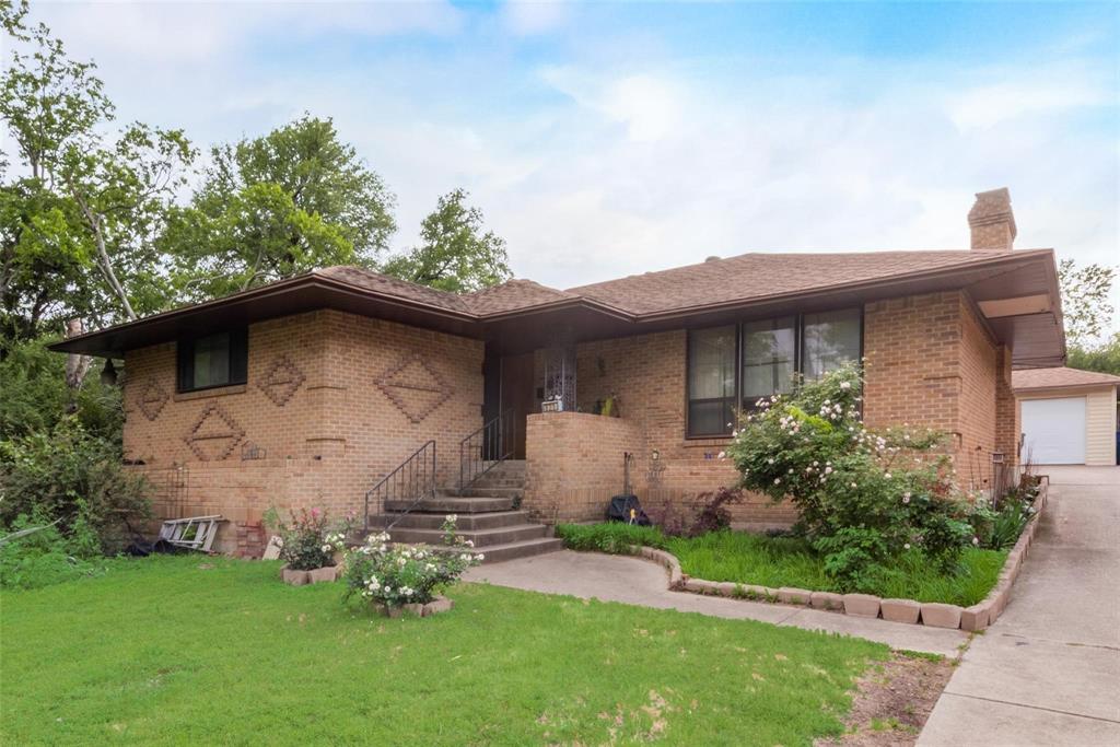 a front view of house with garden