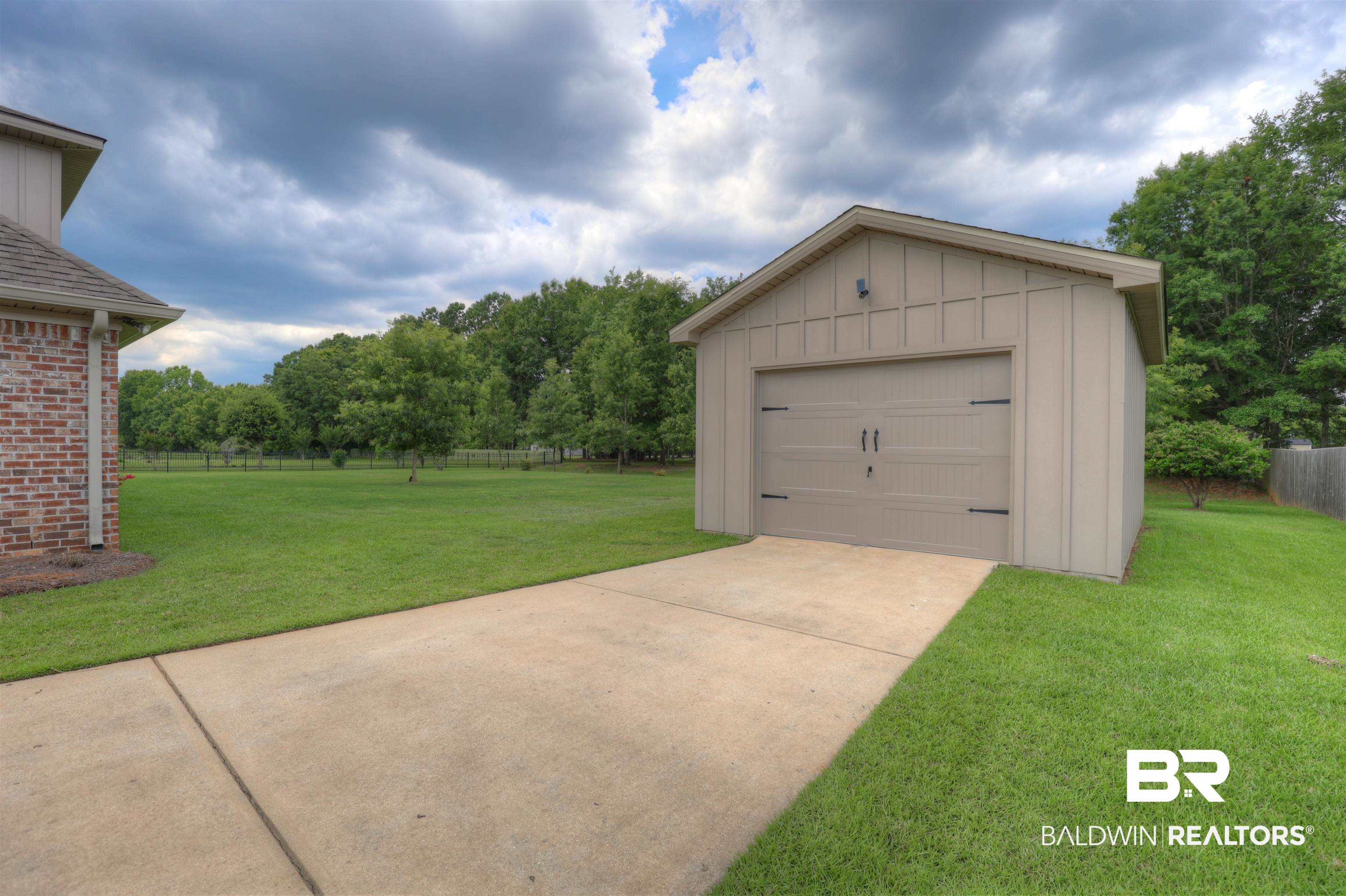 10588 Leesburg Pike Daphne, AL 36526 - Photo 28 of 29 Garage featuring a yard