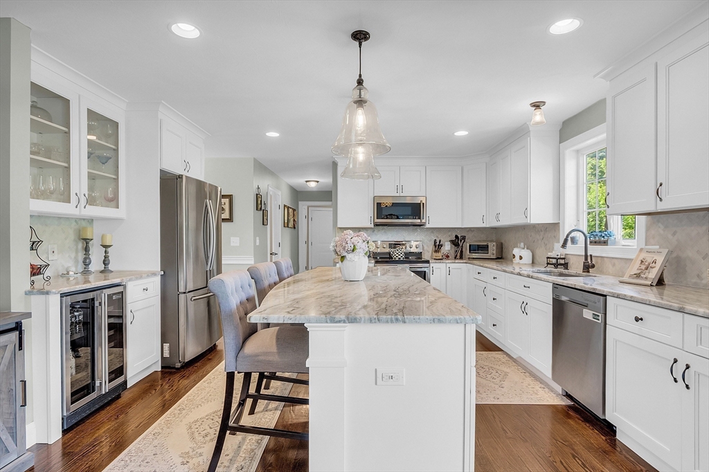65 Easter Brook Road Lunenburg, MA 01462 - Photo 13 of 39 a kitchen with a sink stainless steel appliances and white cabinets