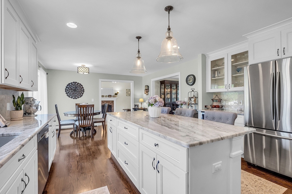 65 Easter Brook Road Lunenburg, MA 01462 - Photo 14 of 39 a large kitchen with kitchen island a large counter top space a sink stainless steel appliances and cabinets