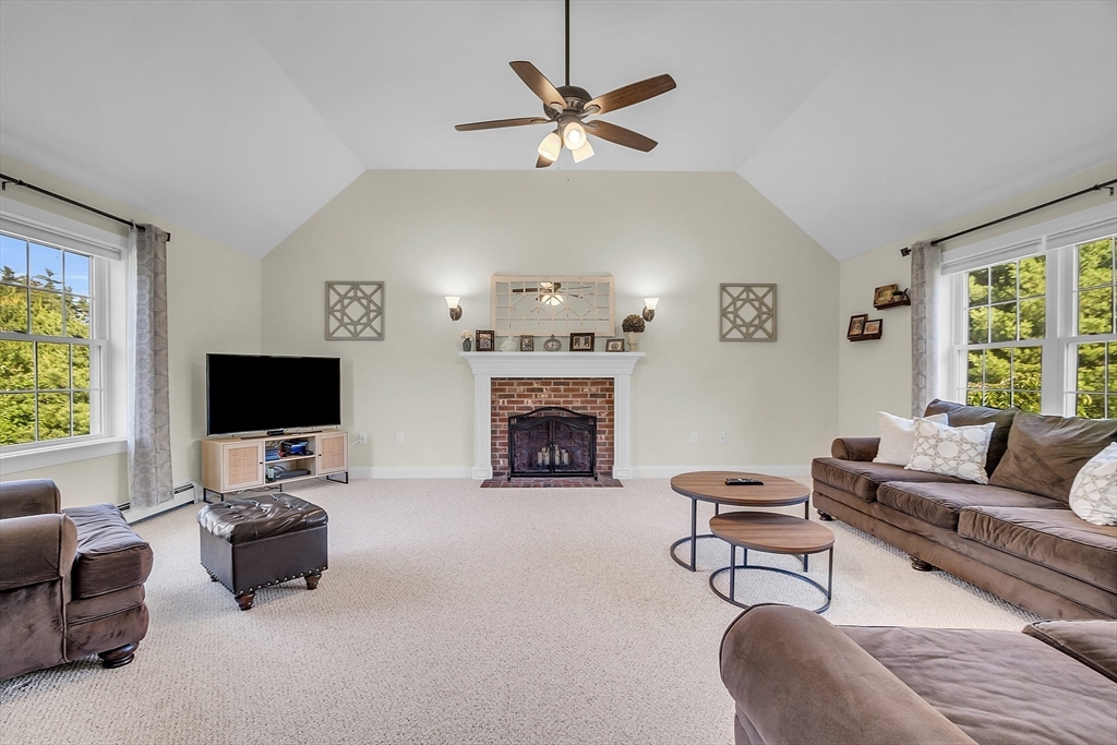 65 Easter Brook Road Lunenburg, MA 01462 - Photo 19 of 39 a living room with furniture and a fireplace
