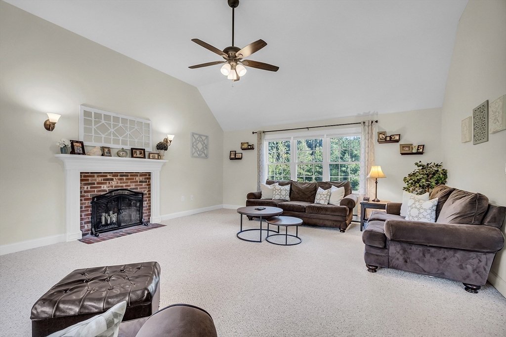 65 Easter Brook Road Lunenburg, MA 01462 - Photo 20 of 39 a living room with furniture and a fireplace
