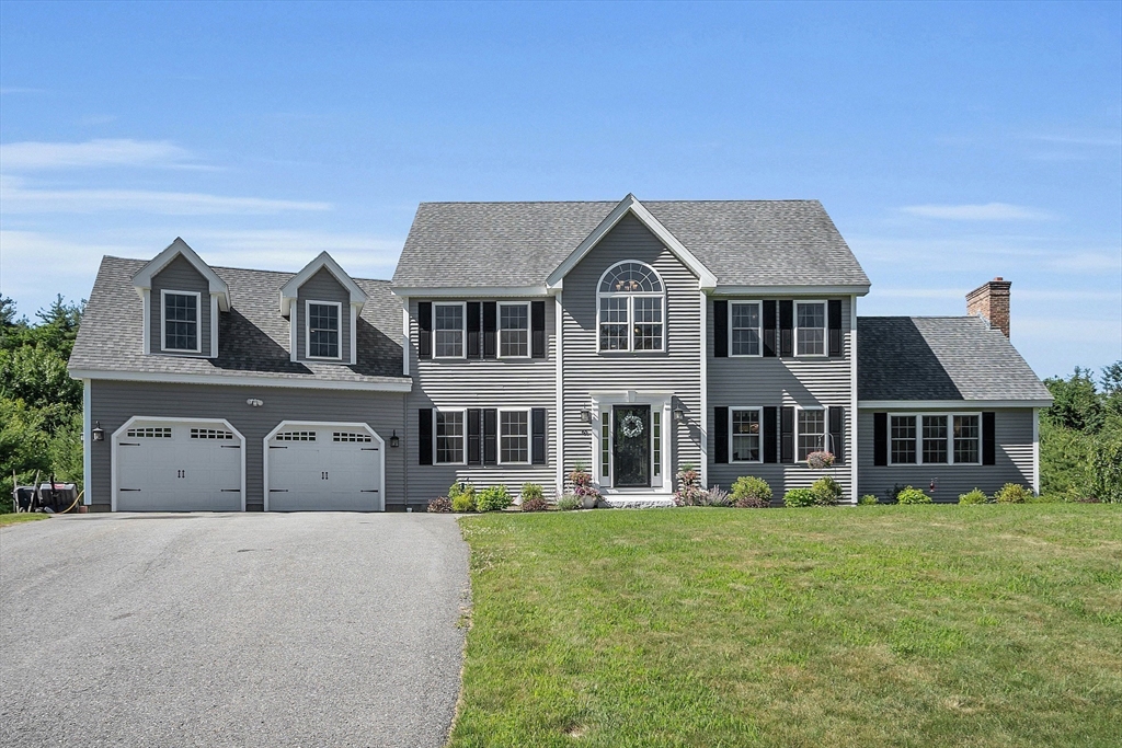 65 Easter Brook Road Lunenburg, MA 01462 - Photo 2 of 39 a front view of a building with a yard