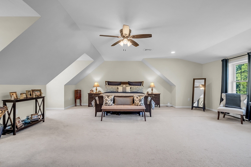 65 Easter Brook Road Lunenburg, MA 01462 - Photo 23 of 39 a bedroom with furniture and a chandelier