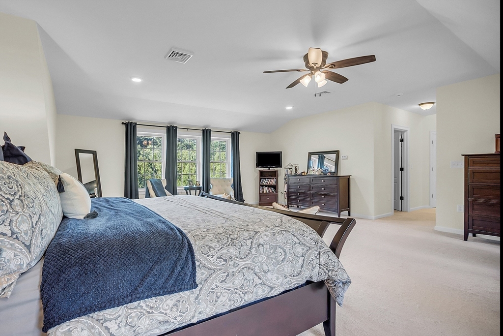 65 Easter Brook Road Lunenburg, MA 01462 - Photo 25 of 39 a bedroom with a large bed and a flat tv screen